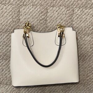 Elegant Cream Handbag with Gold Accents